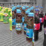different types of glass bottles on a conveyor
