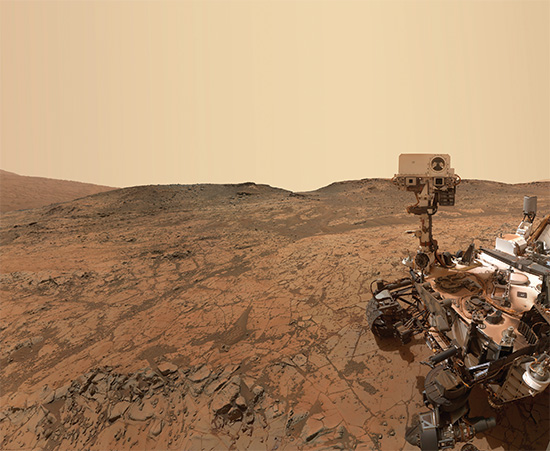 NASA’s Curiosity rover took of itself with its robotic Mars Hand Lens Imager camera arm on October 5, 2015 (its 1,126th in service). In the background is Mars’ Gale Crater. Image courtesy NASA