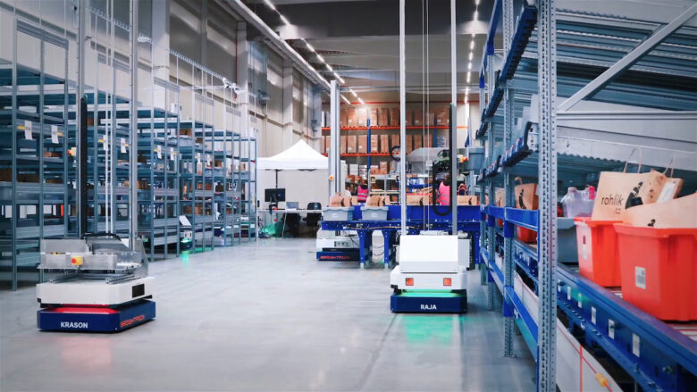 Brightpick Autopicker robots moving around autonomously in Rohlik Group's Prague warehouse.
