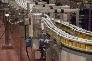 beer cans on a bottling line in a brewery